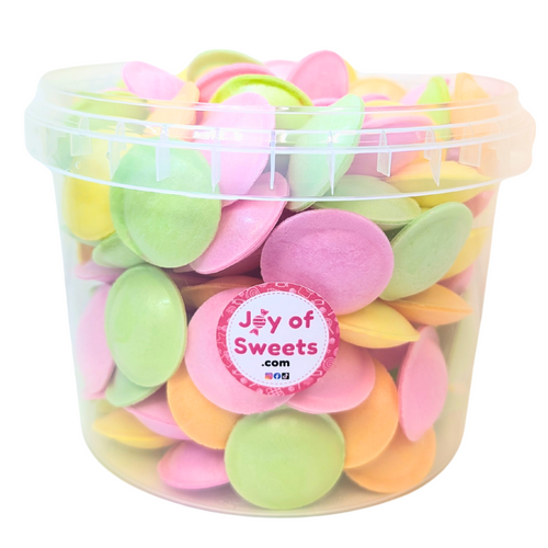 Colorful flying saucer sweets with sherbet filling inside a transparent plastic bucket with handle